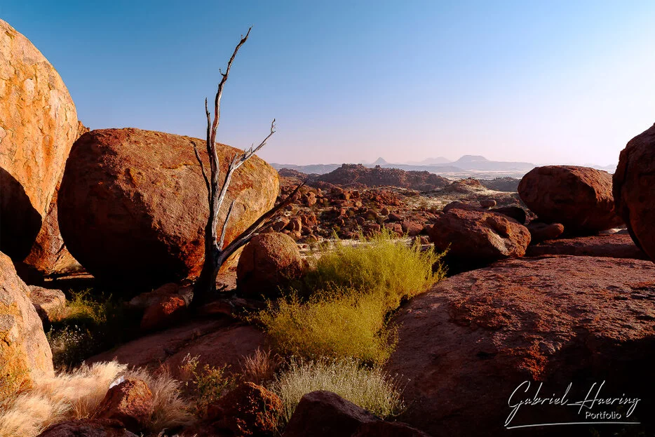 Desert landscape and rocky mountain formations in Damaraland, Namibia